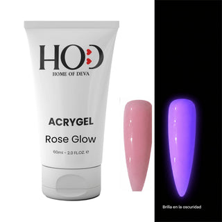 Acrigel profesional Rose Glow 60 ml de Home of Deva con una uña en tono rosa nude y la misma uña brillando en la oscuridad en azul violeta